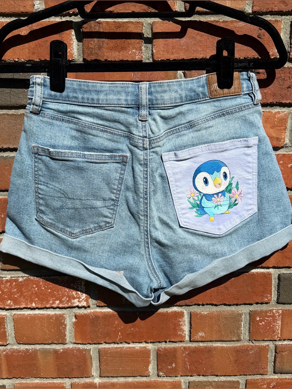 Hand-Painted American Eagle Cuffed hem shorts with Piplup design Size 4